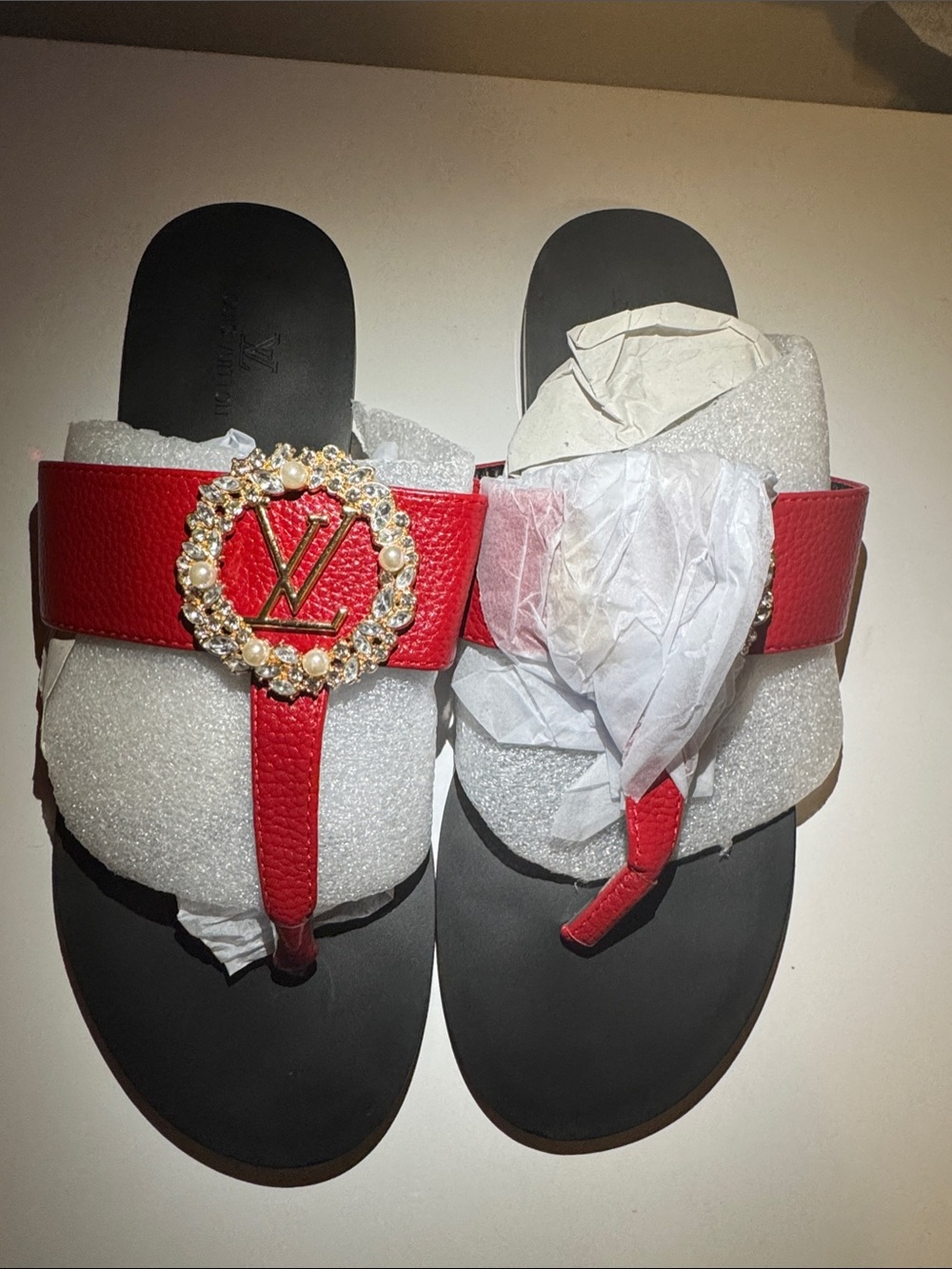 Luxury Red Leather Thong Sandals with Decorative Emblem